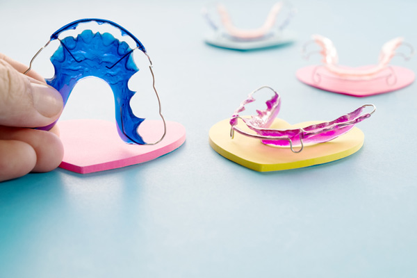 Photo of 4 orthodontic retainers available at Raleigh Family Orthodontics in Raleigh, NC