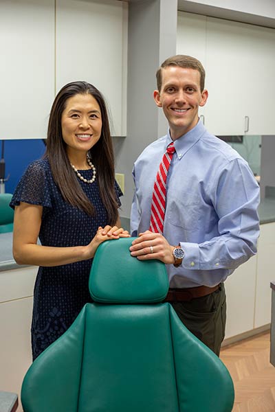 Dr. Neill & Dr. Lee smiling at Raleigh Family Orthodontics.